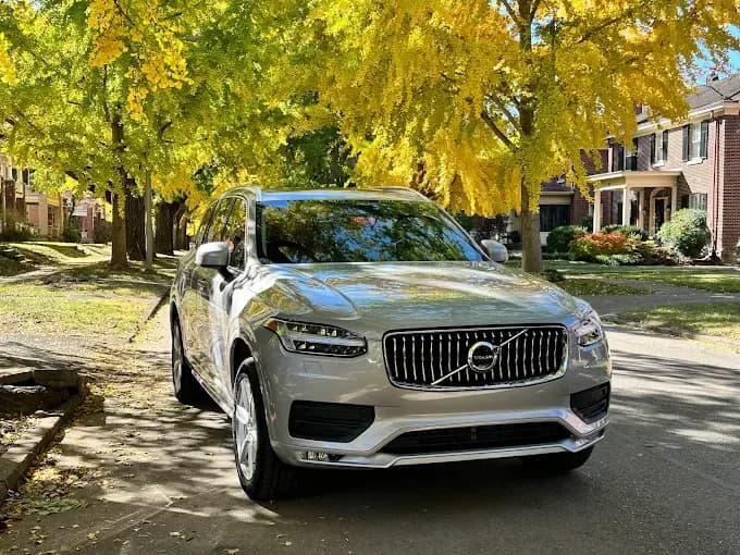 Silver Volvo on an autumn street